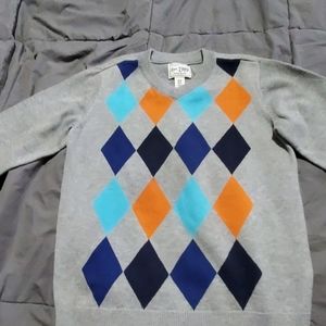 Children place sweater